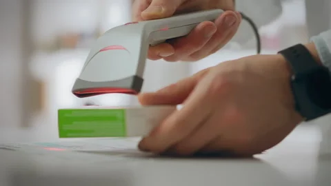 Pharmacist. The pharmacist is equipped with tools to effectively scan drugs Stock Footage 276914491