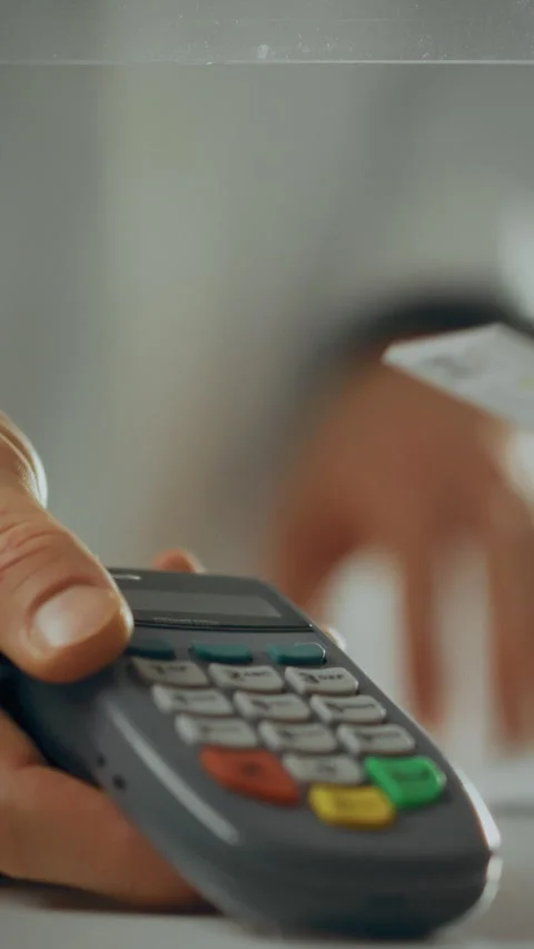 Pharmacist processing payment in a drug store using electronic equipment dur Stock Footage 331676715
