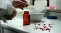 pharmacist puts capsules in a jar HD Footage
