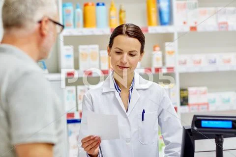 Pharmacist reading prescription and senior man Stock Photos