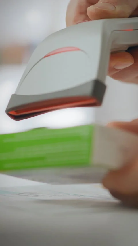Pharmacist scanning medication for patient prescriptions in a pharmacy setti Stock Footage 331676771