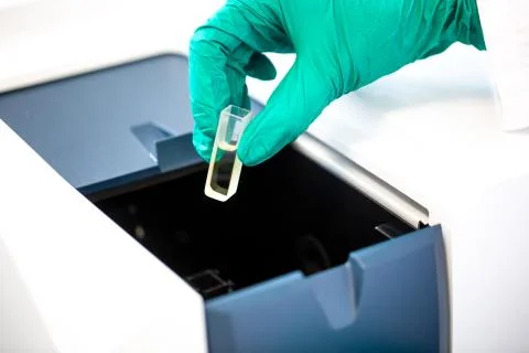 Pharmacist, scientist inserts some samples for chromatographic testing, pharmacy 写真素材