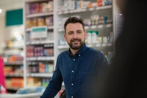 Pharmacist serving customer Stock Photos