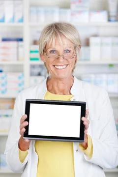 Pharmacist showing a tablet Stock Photos