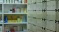 Pharmacist taking medicines from the drawer HD Footage