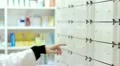pharmacist taking medicines from the drawer HD Footage