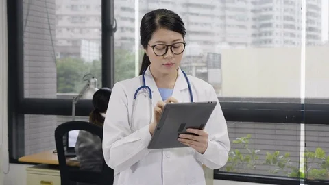 Pharmacist using digital tablet checking medicine Stock Footage 108492034