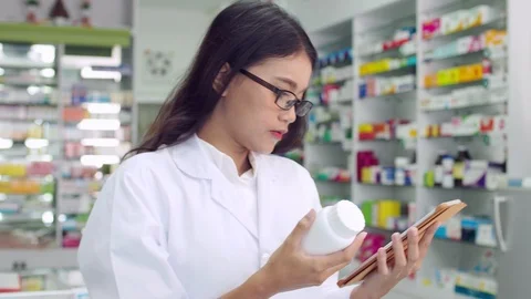 Pharmacist working in drugstore Stock Footage 113976279
