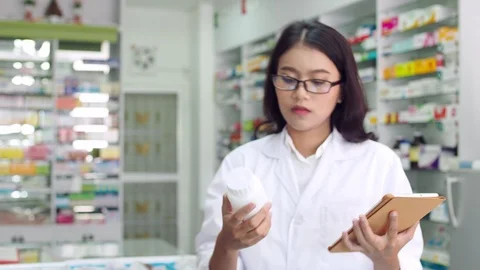 Pharmacist working in drugstore Stock Footage 113976281