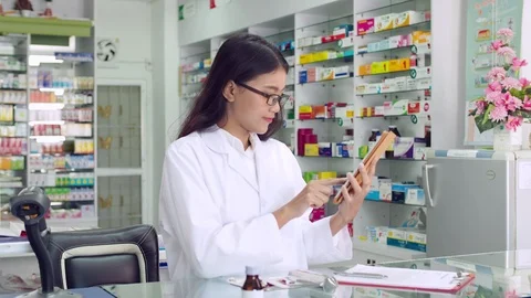 Pharmacist working in drugstore Stock Footage 113976338