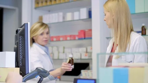 Pharmacists working together in pharmacy Stock Footage 88991326