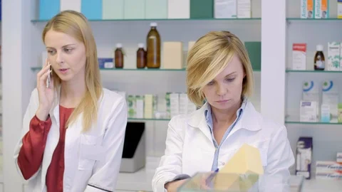 Pharmacists working together in pharmacy Stock Footage 88993851