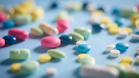 Pharmacy background on a  table. Tablets on a blue background. Pills. Medicin Stock Photos