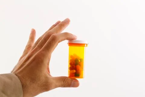 Pharmacy capsules in mans hand Stock Photos