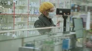 Pharmacy Client With A Mask In Front Of The Desk. Healthcare Business Stock Footage