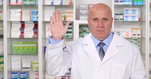 Pharmacy Employee in a TV Interview Presentation Make Salute Hand Gestures Stock Footage 83685012