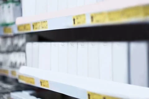 Pharmacy, empty and medication on shelf in store for prescription, vitamins.. Stock Photos