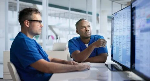 Pharmacy Manager Checks Medication Inventory Using Advanced Software System. Stock Photos