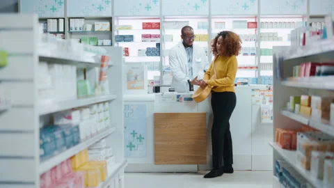 Pharmacy Pharmacist Checkout Servicing Customers Video stock 147947342