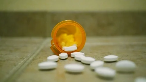 Pharmacy Pill Bottle Pull-Out Slow Motion Pan Stock Footage 106474893