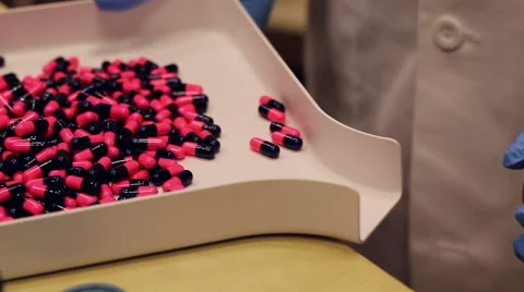 Pharmacy Pills into Bottle Stock-Footage 49544459