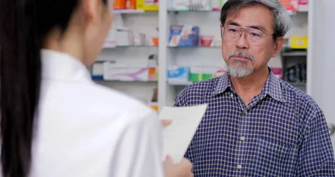 Pharmacy Read prescriptions from customers. Stock Footage 146439650