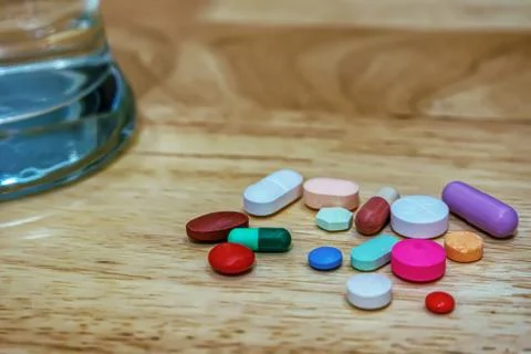 Pharmacy theme, Heap of multicolor round pills Stock Photos