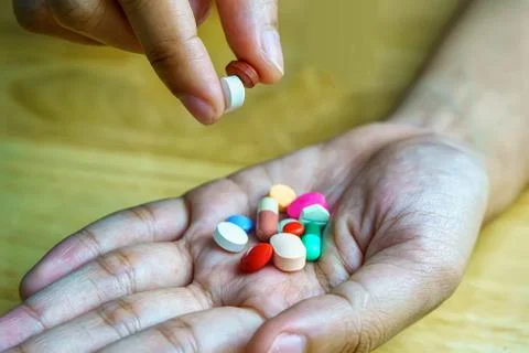Pharmacy theme, Heap of multicolor round pills Foto stock