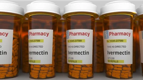Pharmacy vials with ivermectin generic drug pills as a possible coronavirus Stock Footage 128102570