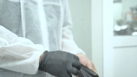 Pharmacy workers use gloves to check production quality Stock Footage 160253476