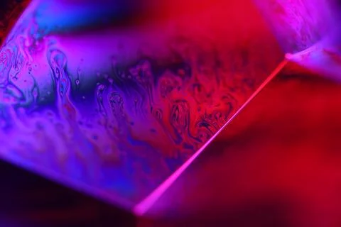 Phenomenal purple liquid pattern in macro, bright fluid background Stock Photos