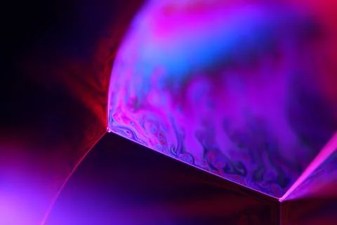 Phenomenal purple liquid pattern in macro, bright fluid background Stock Photos