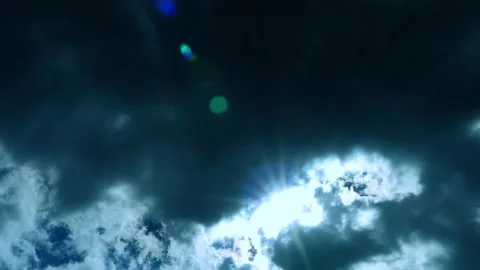 Phenomenon of Glowing Bright Sun from under Terrible Black Cloud in Sky, Slow Mo Stock Footage 172573552