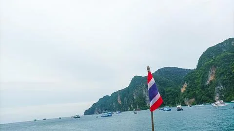 Phi Phi Island on August 15, 2025: Thai national flag waves Foto stock