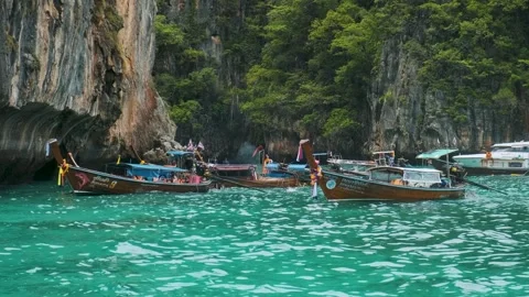Phi Phi, Thailand - May 31, 2024: Traditional Thai wooden long-tail boats Stock Footage 288110018