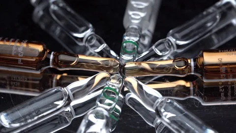 Phials turn on a mirror turntable Stock Footage 127761406