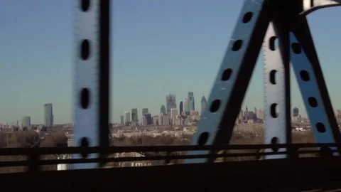 Philadelphia Skyline while driving over the Betsy Ross Bridge Stock Footage 77811245
