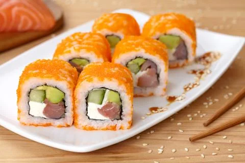 Philadelphia sushi roll with smoked salmon, avocado, cream cheese, cucumber and Stock Photos