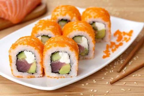 Philadelphia sushi roll with tuna, avocado, cream cheese, cucumber and tobiko Stock Photos