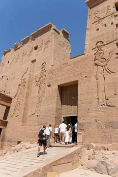 Philae temple visitors exploring ancient egyptian monumental architecture Stock Photos