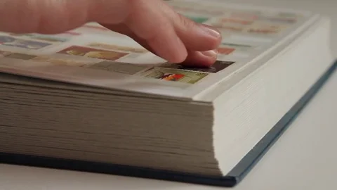 Philatelist Browsing Vintage Postage Stamp Collection in an Album, Close Up Stock Footage 75421990