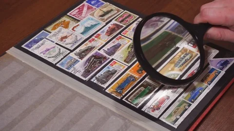 Philately. Browsing pages of stockbook Stock-Footage 74909122