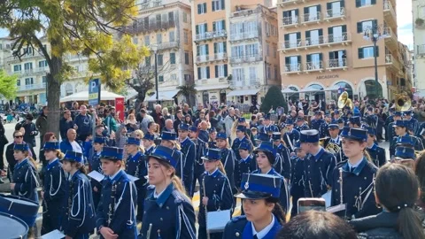 Philharmonic marching band parade in uniform playing brass instruments for a Video stock 334638752