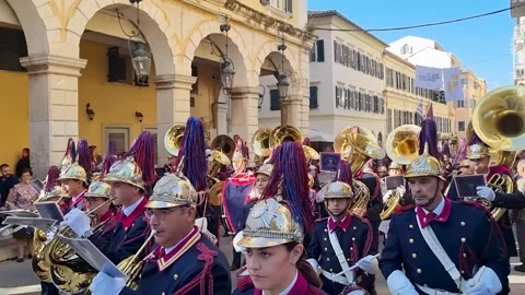 Philharmonic Marching Band Playing Brass Instruments in Parade on Oxi Day in Stock-Footage 332531809