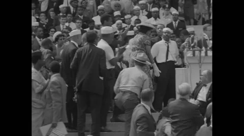 A. Philip Randolph shaking hands with Marian Anderson on stage Stock Footage