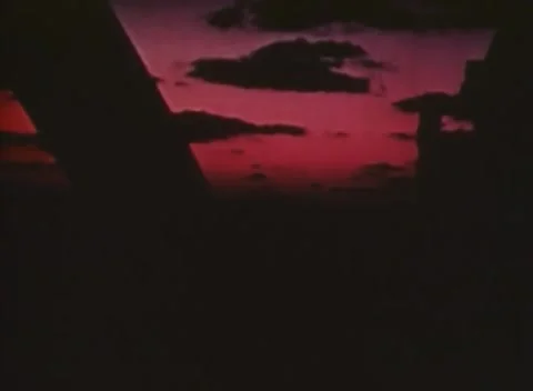 PHILIPPINES - 1943: Naval battle - Red Sunset Sky With A Dark Ship 库存影片 343786560