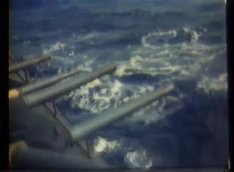 PHILIPPINES - 1945: Naval bombardment - A muzzle blast streaks across the sea 스톡 동영상 343931827