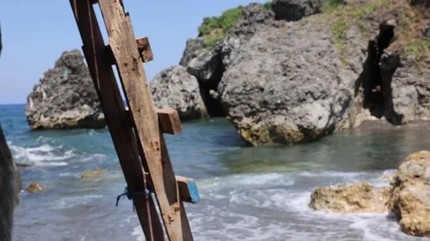 PHILIPPINES - 4.28.2024 - Waves roll towards the rocky shore of Basco Port in Stock Footage 288191888