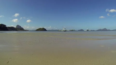 Philippines beach view overlooking pristine bay with pump boats. Panning. Stock Footage 49243794