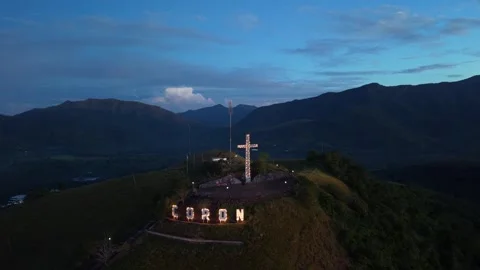 Philippines, Coron, 28 May, 2026 Sign and Cross Above Mountains Vídeo Stock 335512384